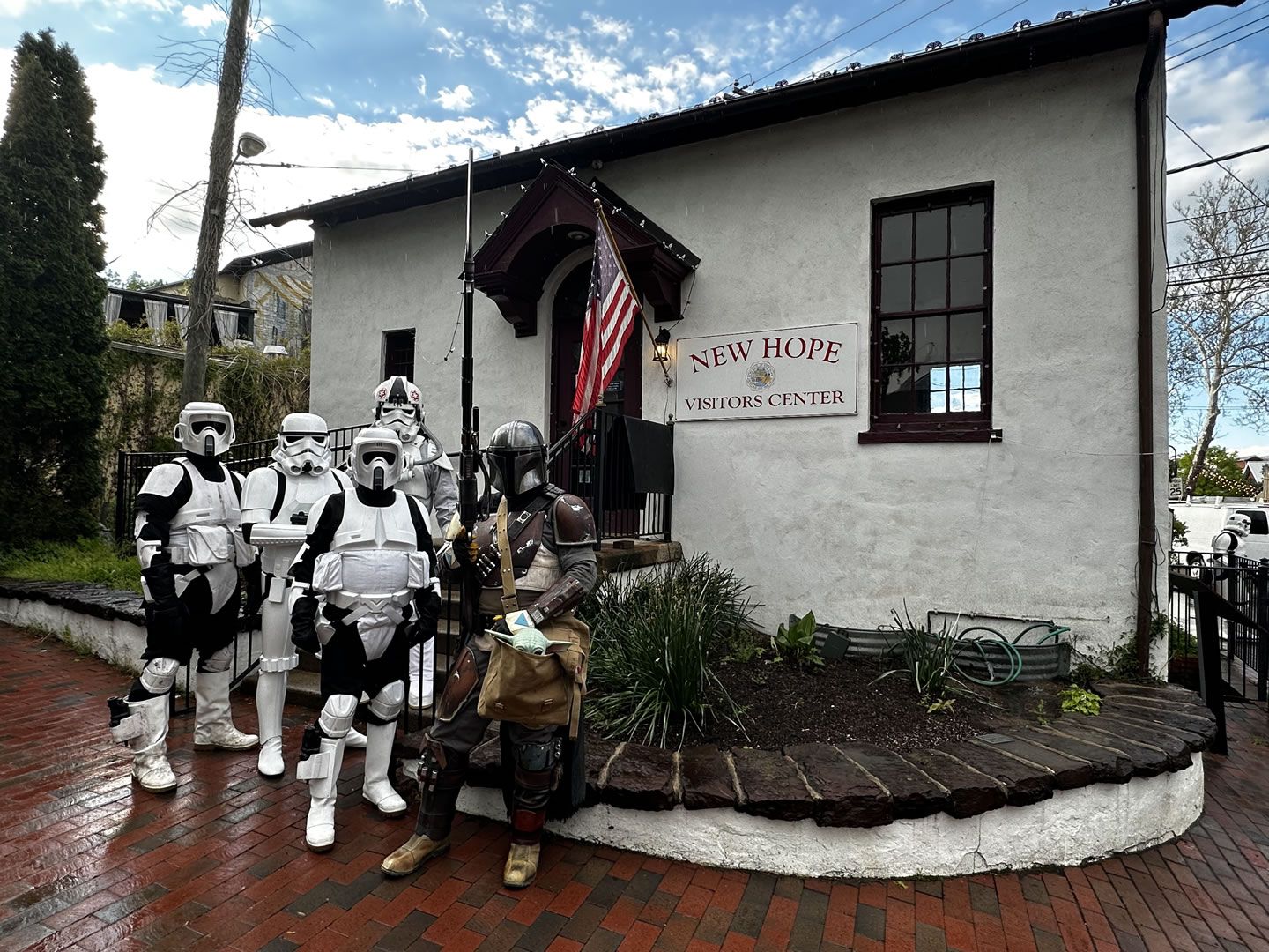 Stormtroopers and a Mandalorian posing outside the New Hope Visitors Center